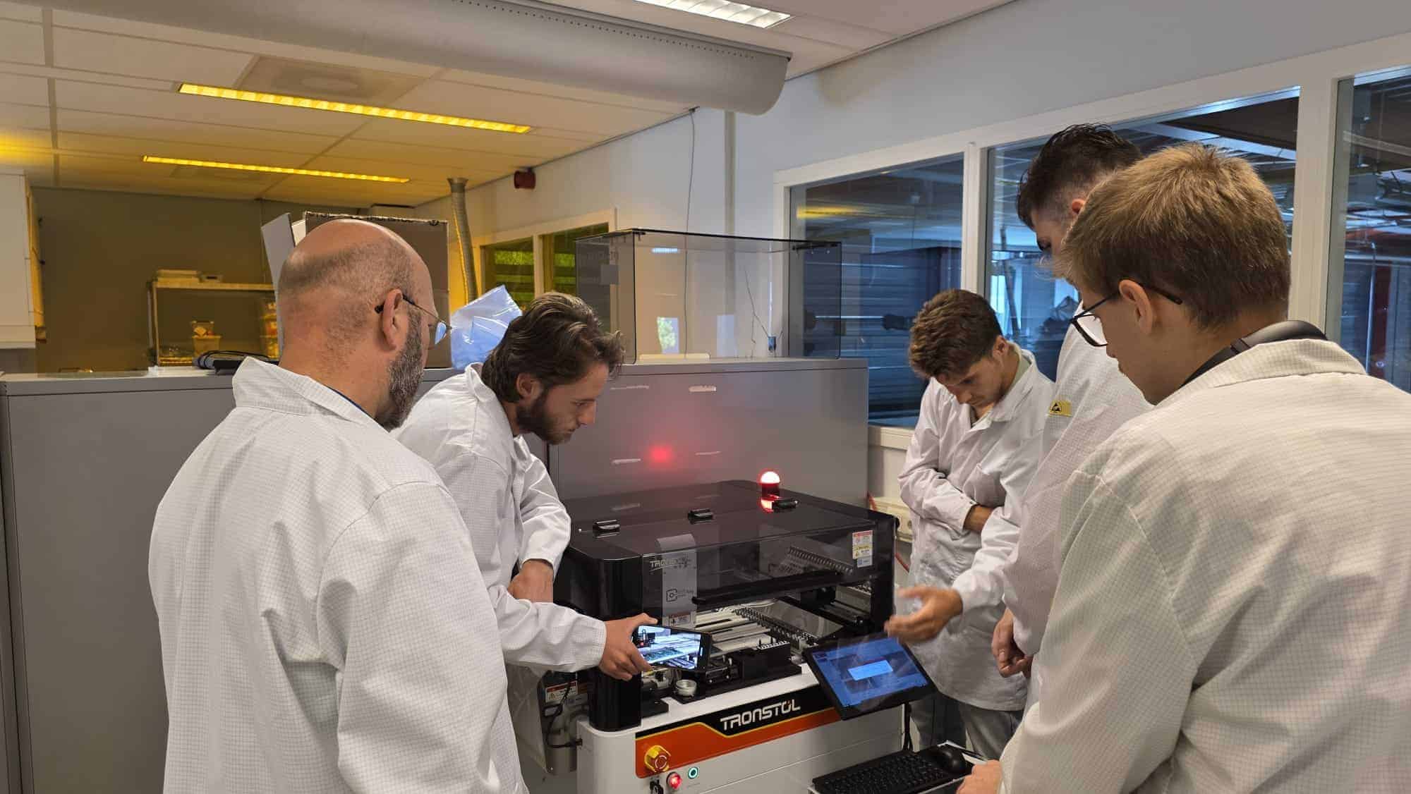 Electronics prototype connected to measurement equipment during validation testing
